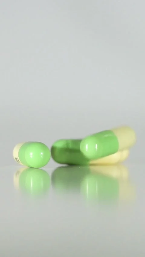 Falling Pills in Slow Motion – Vertical Healthcare Background Stock Footage 328667812