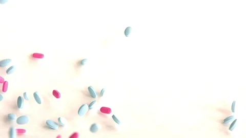 Falling pink and blue pills Stock Footage 89208857