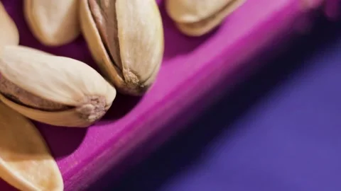 Falling pistachio nuts close up Stock Footage