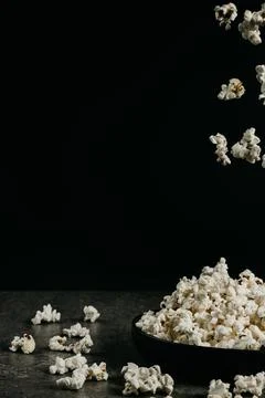 Falling pop corn on black background 写真素材