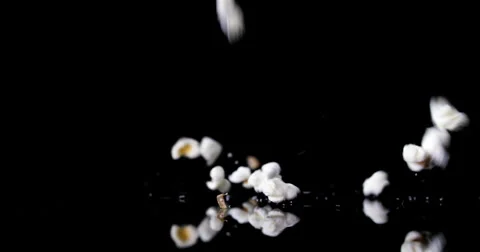 Falling popcorn on black backgorund Video stock 55880028
