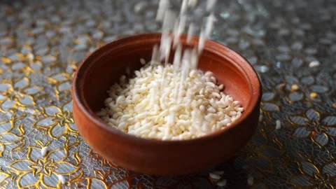 Falling puffed rice in a bowl Stock Footage 332688743