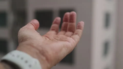 Falling Rain Drops to Female Hand in Slowmotion. Bad Weather Outside Window Stock Footage 278299301