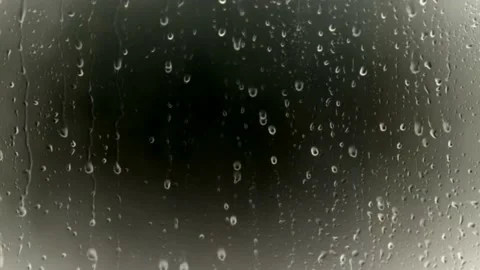 Falling rain drops on window glass Stock Footage 132412801
