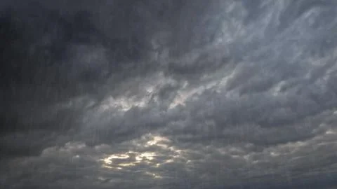 Falling rain on sky with clouds - beautiful weather bg - photo of nature Stock Photos