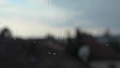 Falling rain on window surface Stock Footage 135915146