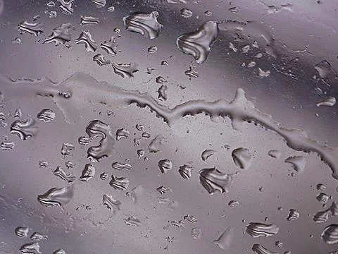 Falling raindrops create unusual and amazing Stock Photos