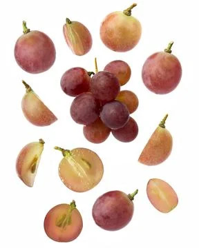 Falling red grape , isolated on white background, selective focus Stock-Fotos