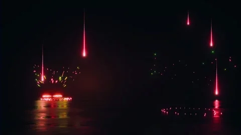 Falling red lines creating colorful laser bursts on dark water surface Stock Footage 327520402