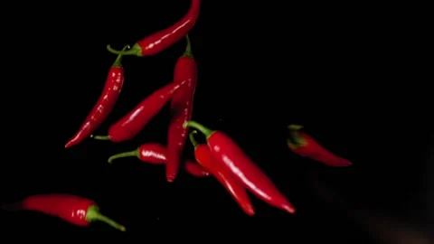 Falling of red pepper. Slow motion Stock Footage 139402400