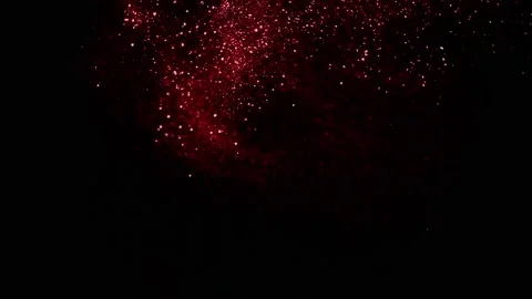 Falling red shiny dust particles on alph... | Stock Video | Pond5