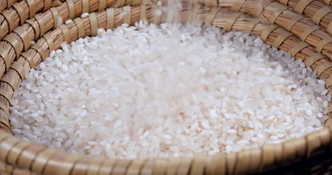 Falling rice seed on bamboo container Stock Footage 162615311
