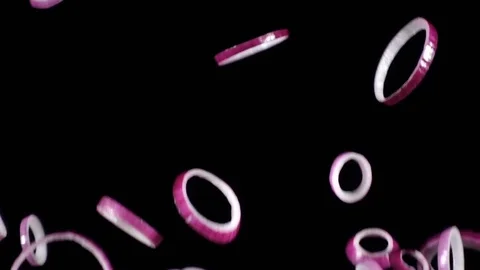 Falling rings of red onion slices, slow motion Stock Footage 83146513