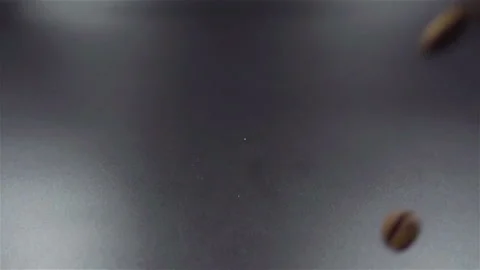 Falling Roasted Coffee Beans on a Black background in Slow Motion Stock-Footage 104576297