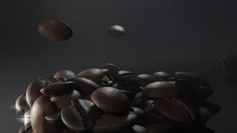 Falling roasted coffee beans bouncing, forming compact mound on reflective Видео 337505083