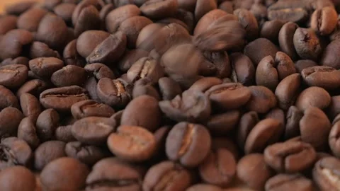Falling Roasted Coffee Beans close up. Stock Footage 195976960