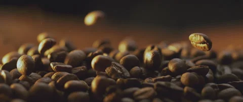 Falling roasted coffee beans Video stock 247383136