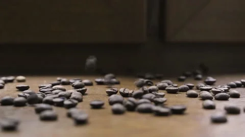 Falling Roasted Coffee Beans into Ground Coffee on Wooden Background Vídeos de archivo 217426776