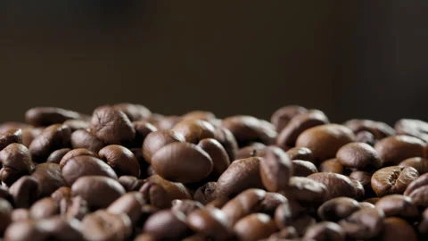 Falling roasted coffee beans onto a heap 動画素材 316070890