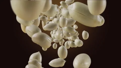 Falling of Roasted Peanuts in Brown Chocolate Background Video stock 148387509