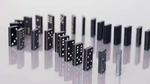 Falling row of dominoes Stock Footage 70375875
