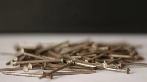 Falling rusty nails closeup Vídeo Stock 75827311