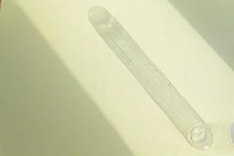 Falling shadow from an empty jar on a bright, sunny day. Stock Photos