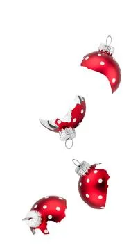Falling shiny red Christmas tree baubles ornaments isolated on pure white b.. Stock Photos