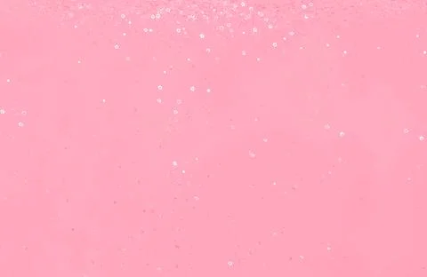 Falling shiny star shaped confetti toned in trendy magenta color of year 2023. Stock Photos