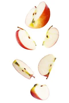 Falling sliced apple isolated on white Stock Photos