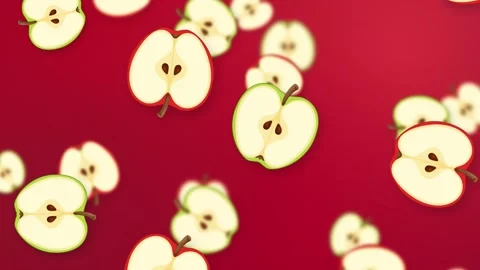 Falling Sliced Red and Green Apples on Vibrant Red Background Stock Footage 344836467