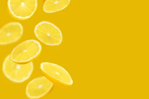 Falling slices of lemon background Stock Photos