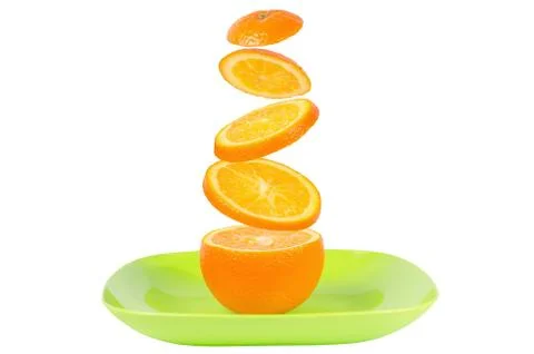 Falling slices of orange in air Stock Photos