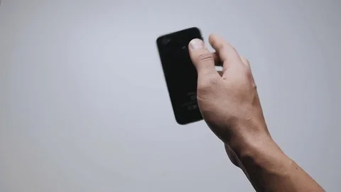 Falling smartphone at floor slow motion. Close up of man's hand drop phone Stock-Footage 70726289