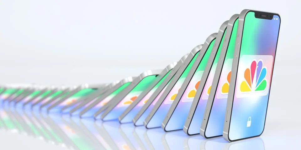 Falling smartphones with logo of COMCAST on the screen, domino effect. Editorial Stock Illustration