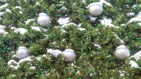 Falling snow on a background Christmas tree with colorful lights Stock Footage 43104923