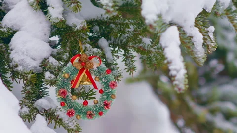 Falling snow on the background of Christmas tree decorations. Stock Footage 231606952