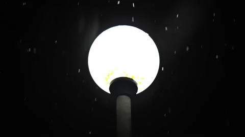 Falling snow on the background of a lantern in winter close-up Stock Footage 171403511
