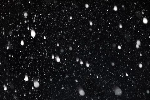 The falling snow. Background Stock Photos