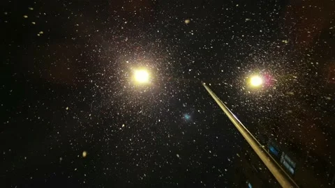Falling snow backlit with modern street lamp in city street at night in winter. Stock Footage 183046530