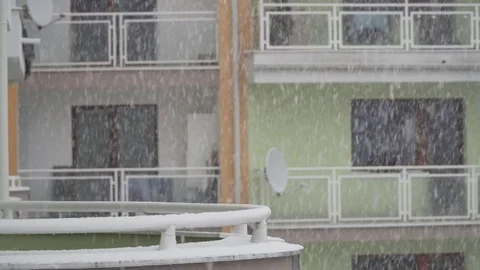 Falling snow with balconies at the background Stock Footage 84150957