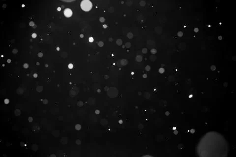 Falling snow on black background. Foto stock