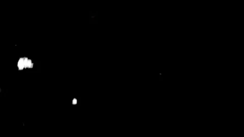 Falling snow on black background. Real Snow falling on dark outside. Small Stock Footage 267666107