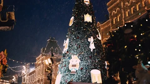 Falling snow. Christmas evening atmosphere Red Square GUM Moscow. Stock Footage 219993876