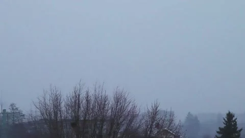 Falling Snow on the City. Winter Background, Falling Snowflakes on Houses, Trees Stock Footage 231752704