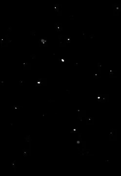 Falling snow dots on black background, isolated visual effect layer Stock Photos