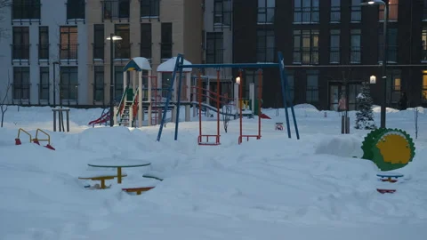 Falling snow falls on the playground. Winter fabulous courtyard Stock Footage 148688368