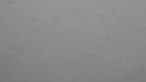 Falling snow on grey background Stock Footage 96995949