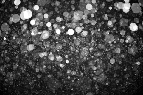 Falling snow isolated on black background Foto stock