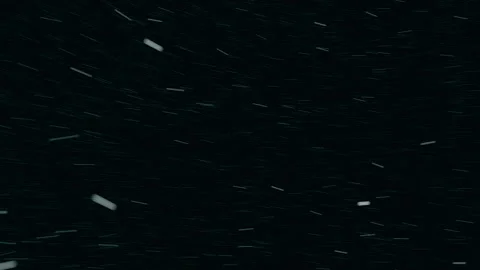 The falling snow motion graphic on a black background is perfect for a winter th Stock Footage 263954522